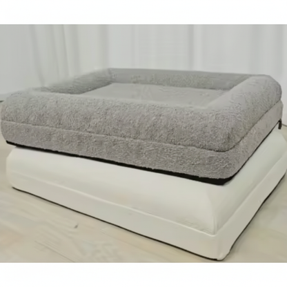 Gray pet bed on a white platform with a white curtain background