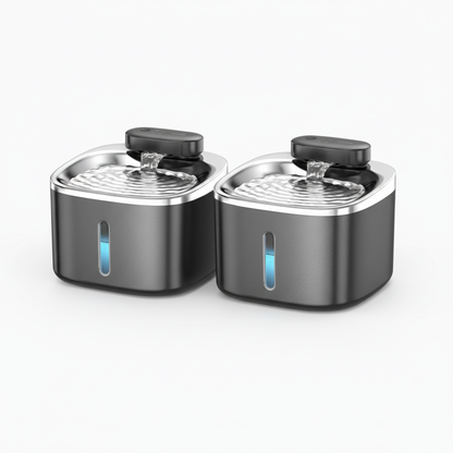 Two black and silver pet water bowls on a white background