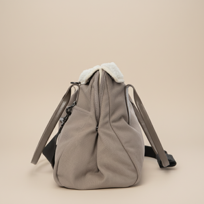 Portable dog tote carrier with multiple storage pockets for treats, toys, and pet essentials